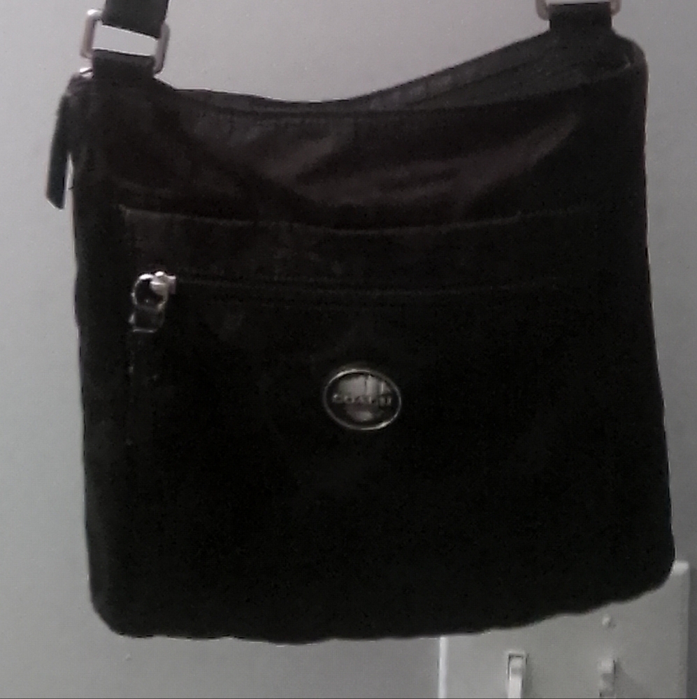 Coach Black Crossbody Bag with Adjustable Strap and Metal Accents